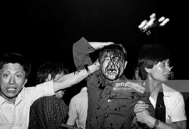 1989, Beijing, China, A wounded soldier of the Chinese army is rescued by students after his tank was destroyed during the Tiananmen Square massacre during the night between the 3rd and the 4th of June, 1989.,; date created: 2008:05:06; Tiananmen Square Massacre