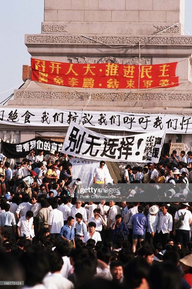 BEIJING, CHINA - 1989/06/01: Pro-democracy demonstrators protest under the obelisk in Tiananmen Square. Pro-democracy demonstrators filled the square for weeks prior to the final nighttime Communist Government's bloody crackdown. Many camped out and slept in the square to keep the democracy protest movement going.. (Photo by Peter Charlesworth/LightRocket via Getty Images)