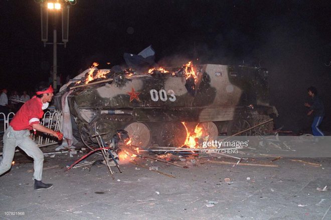 (FILES) This file photo taken on June 4, 1989 shows an armoured personnel carrier in flames as students set it on fire near Tiananmen Square in Beijing. Hundreds, possibly thousands, of protesters were killed by China's military on June 3 and 4, 1989, as communist leaders ordered an end to six weeks of unprecedented democracy protests in the heart of the Chinese capital. Dissidents and human rights advocates around the world will mark on June 4, 2009 the twentieth anniversary of China's bloody crackdown on the pro-democracy protests. AFP PHOTO / FILES / TOMMY CHENGAn armoured personnel carrier is in flames as students put in on fire 04 June 1989 near Tiananmen Square in Beijing. On the night of 03 and 04 June 1989, Tiananmen Square sheltered the last pro-democracy supporters. A series of pro-democracy protests was sparked by the April 15 death of former communist party leader Hu Yaobang. In a show of force, China leaders vented their fury and frustration on student dissidents and their pro-democracy supporters. Several hundred people have been killed and thousands wounded when soldiers moved on Tiananmen Square during a violent military crackdown ending six weeks of student demonstrations, known as the Beijing Spring movement. According to Amnesty International, five years after the crushing of the Chinese pro-democracy movement, "thousands" of prisoners remained in jail. AFP PHOTO TOMMY CHENG (Photo credit should read TOMMY CHENG/AFP/Getty Images)